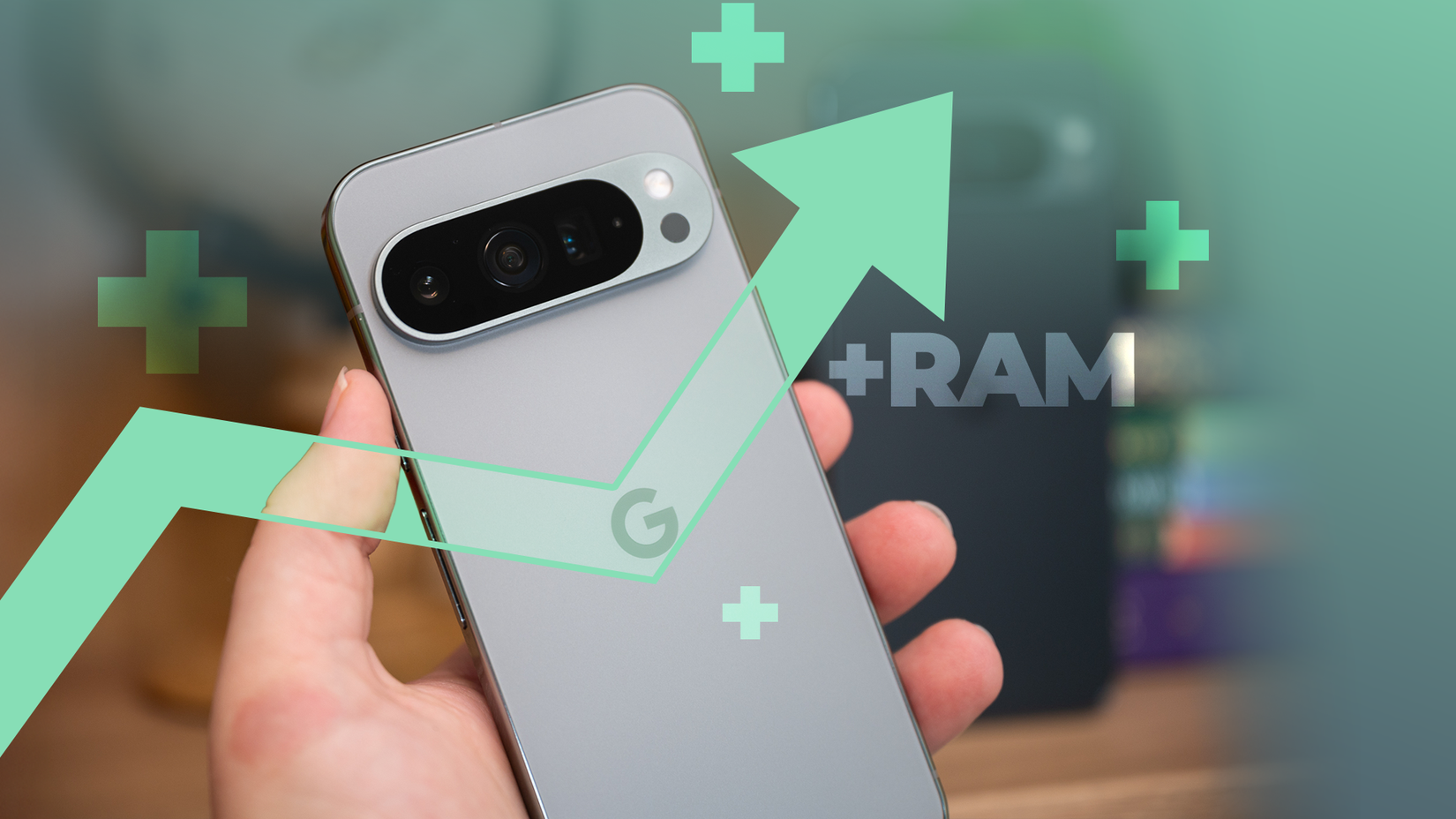Close-up of a hand holding a Google Pixel with a green upward arrow and ' ' symbols.
