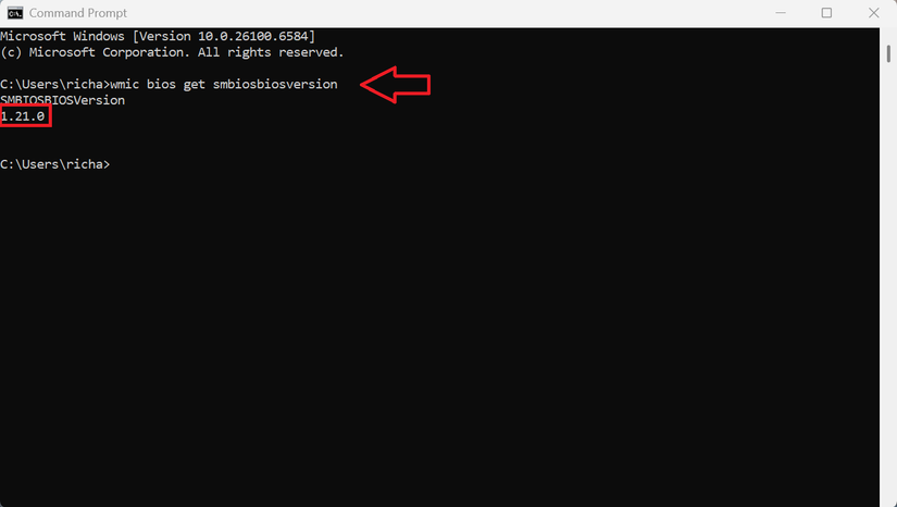 A screenshot of the Windows 11 command prompt dialog with a command that displays the BIOS version.