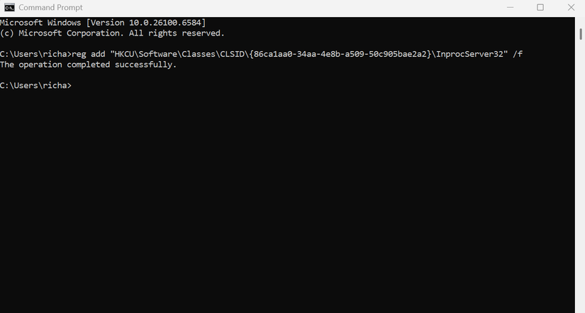 A screenshot of the Windows 11 command prompt dialog with a command typed in to restore the classic long-form menus.