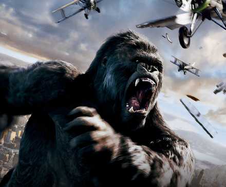 King Kong swatting at aircraft in the sky