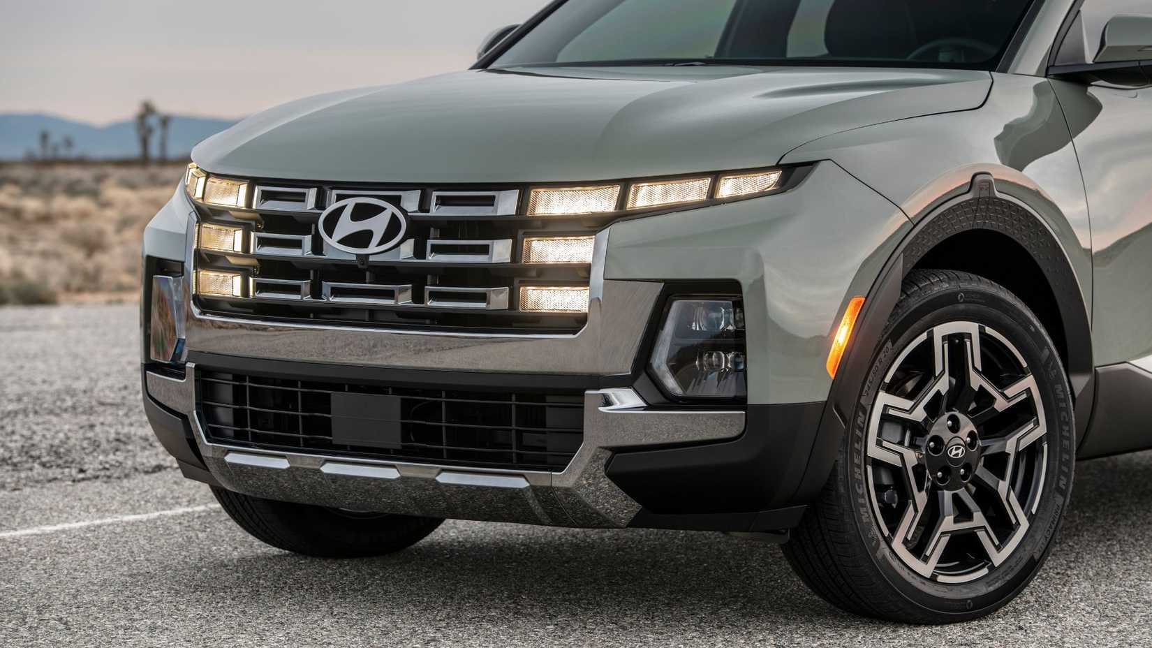 Close-up shot of the front end of a green 2025 Hyundai Santa Cruz Limited.