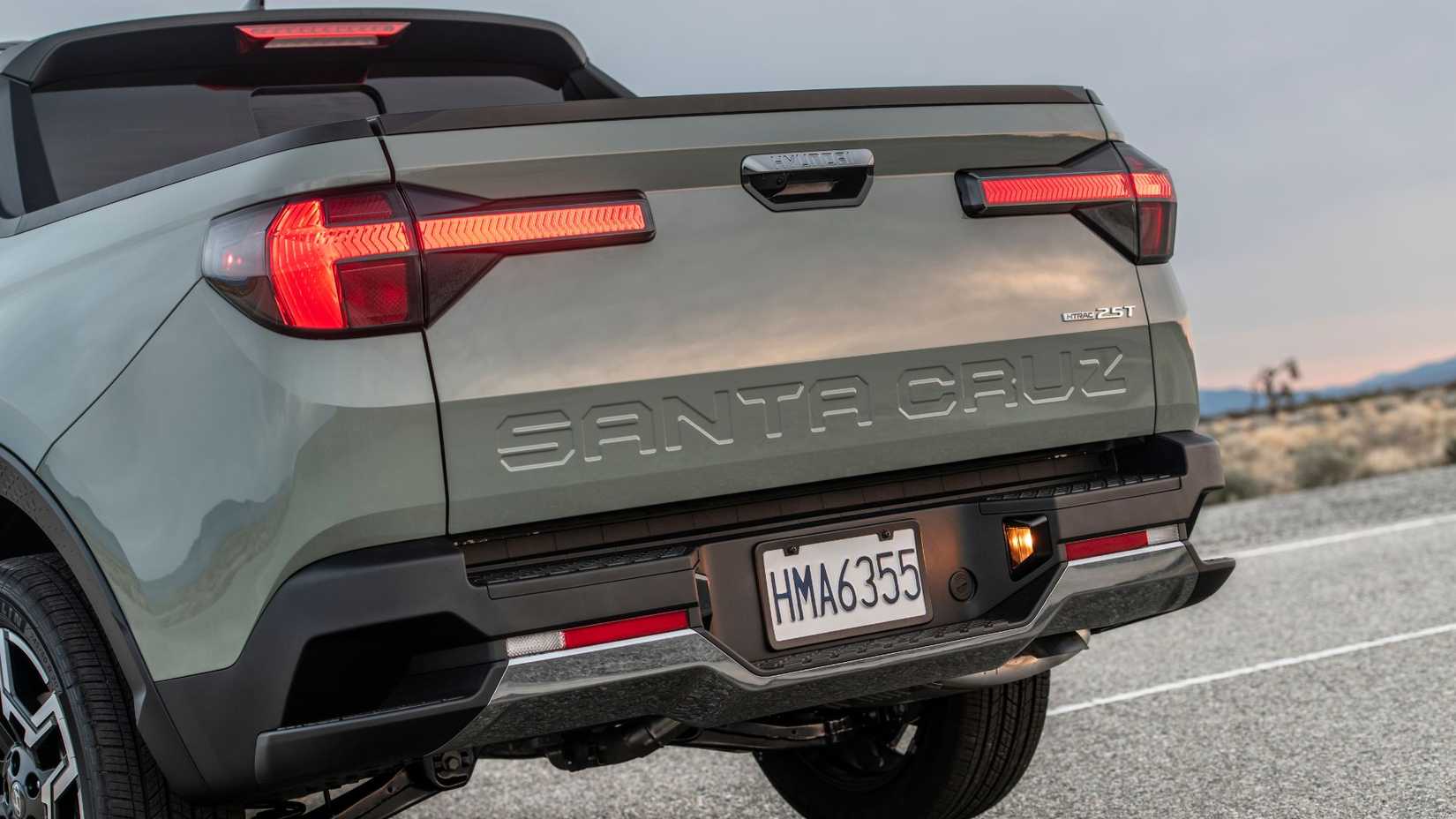 Close-up shot of the rear end of a green 2025 Hyundai Santa Cruz Limited.