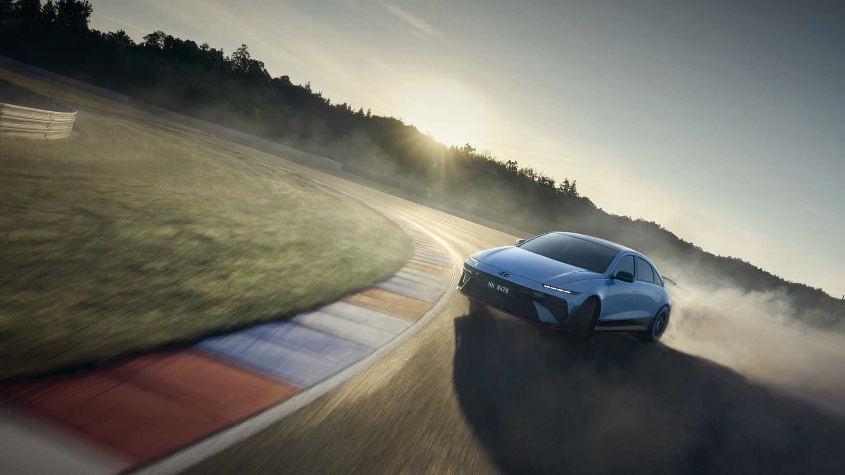 Front 3/4 action shot of a 2026 Hyundai Ioniq 6 N 