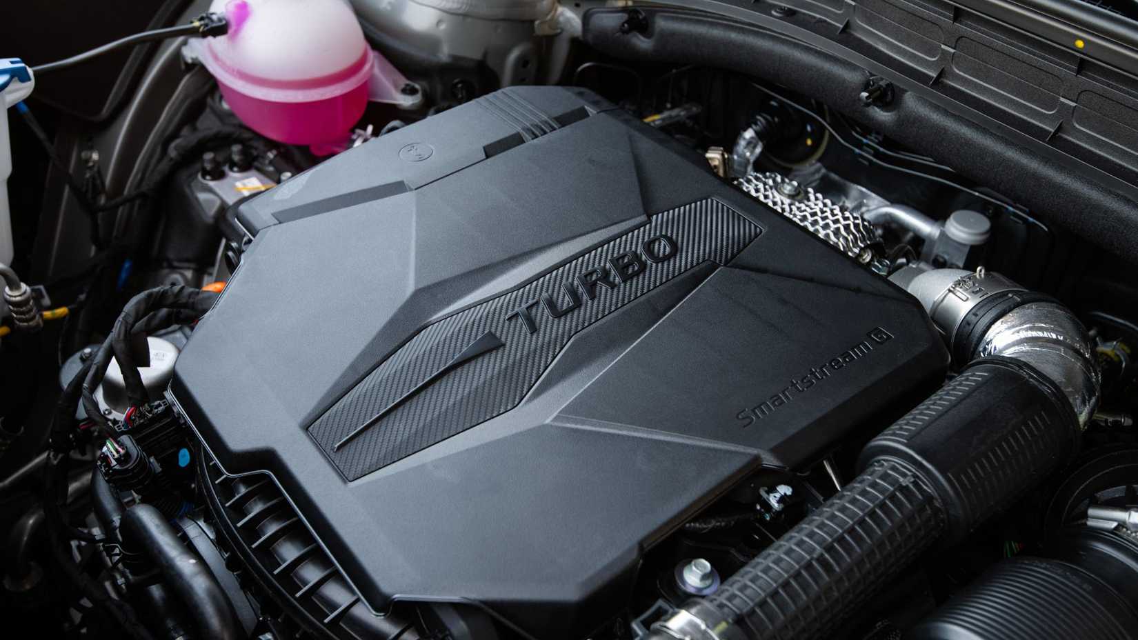 Close-up shot under the hood of a 2026 Hyundai Santa Fe.