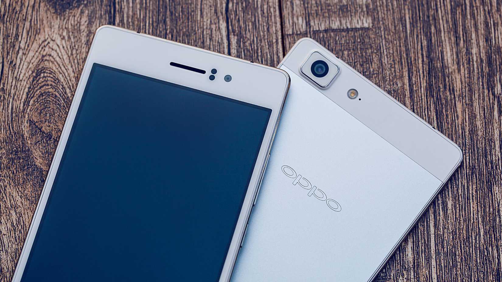 Two Oppo R5 smartphones lying on a table.