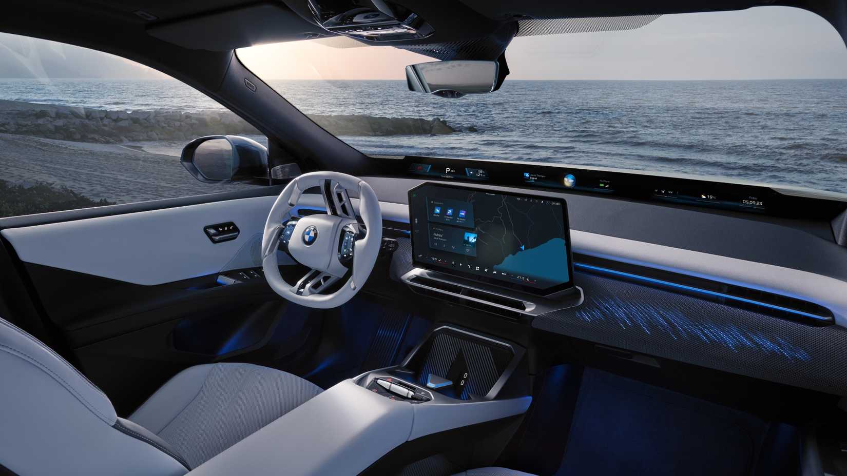 Interior shot of the front seats and dashboard in a 2026 BMW iX3