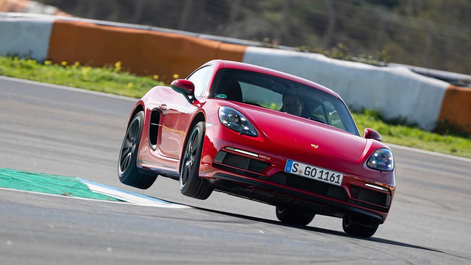 Front 3/4 shot of a 2020 Porsche 718 GTS 4.0 hitting the apex 