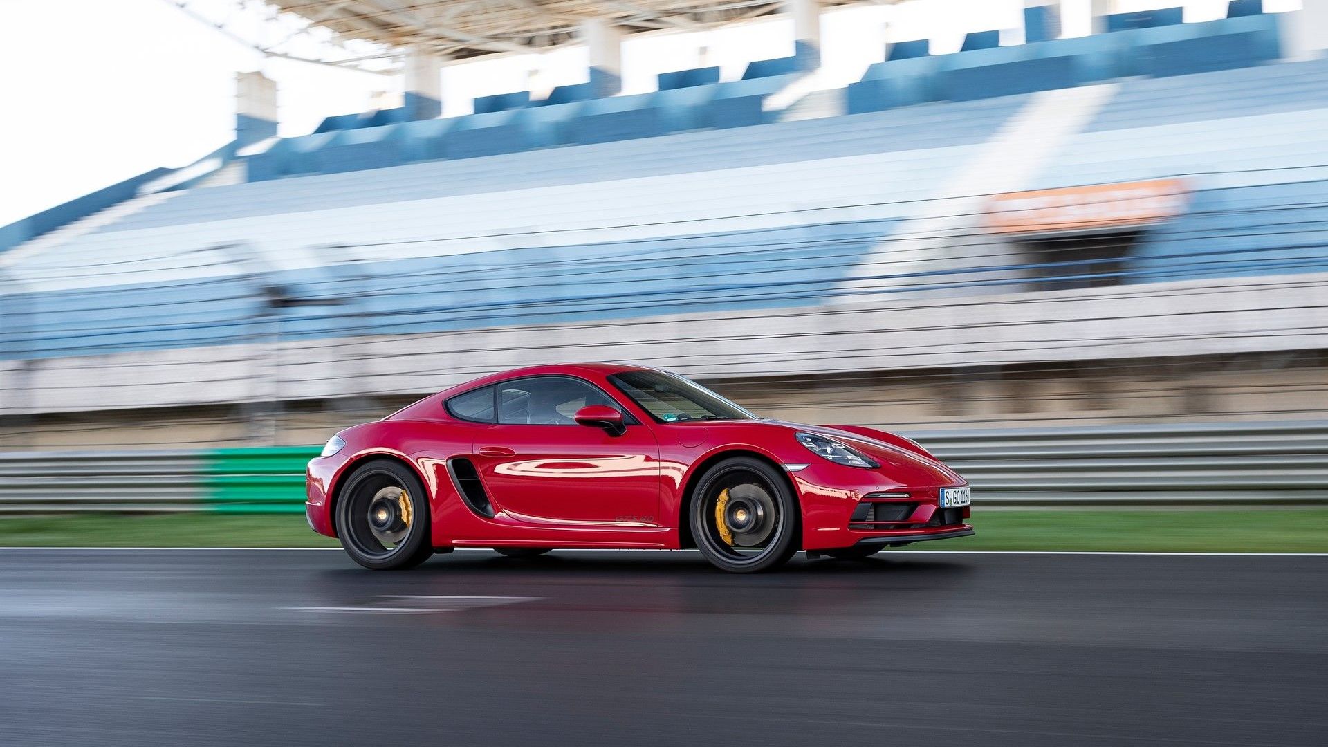 Side profile action shot of a 2020 Porsche 718 GTS 4.0 on the track 