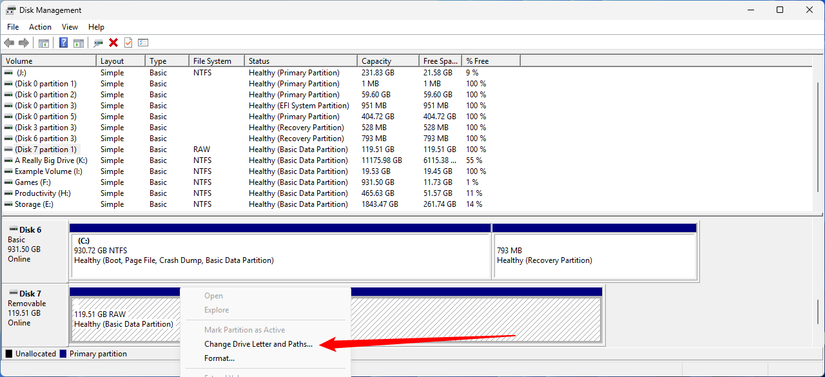 Right-click the drive without a letter and select Change Drive Letter and Paths.