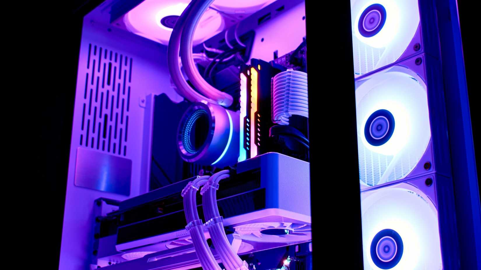 Components of a powerful liquid-cooled gaming computer with a modern graphics card.