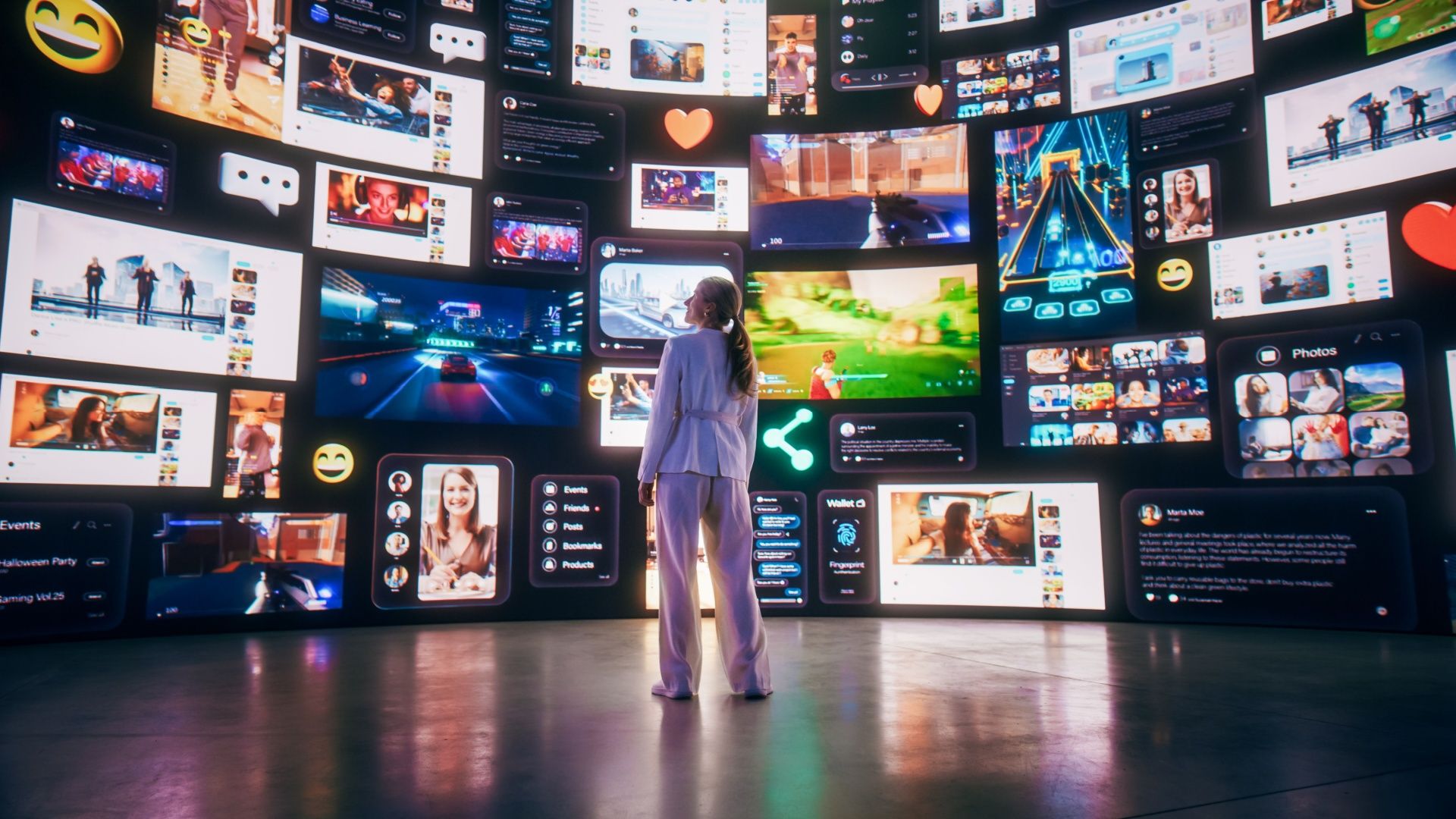 A woman stares at a multitude of playing video windows.