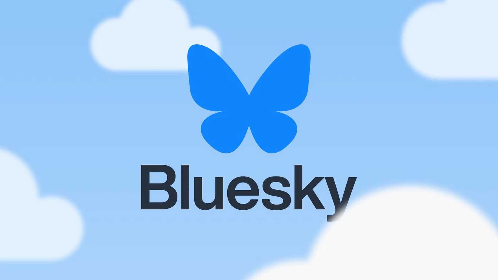 The Bluesky logo over some clouds in the sky.