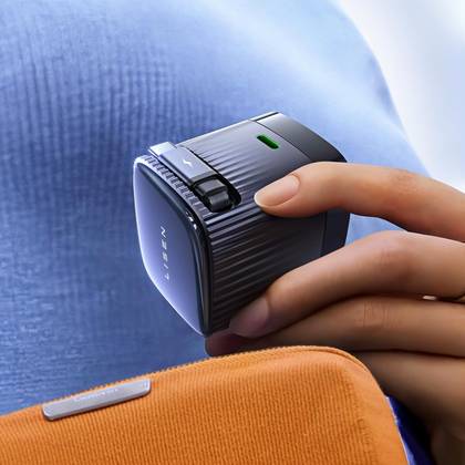 The Lisen Retractable USB-C charger being held in a hand