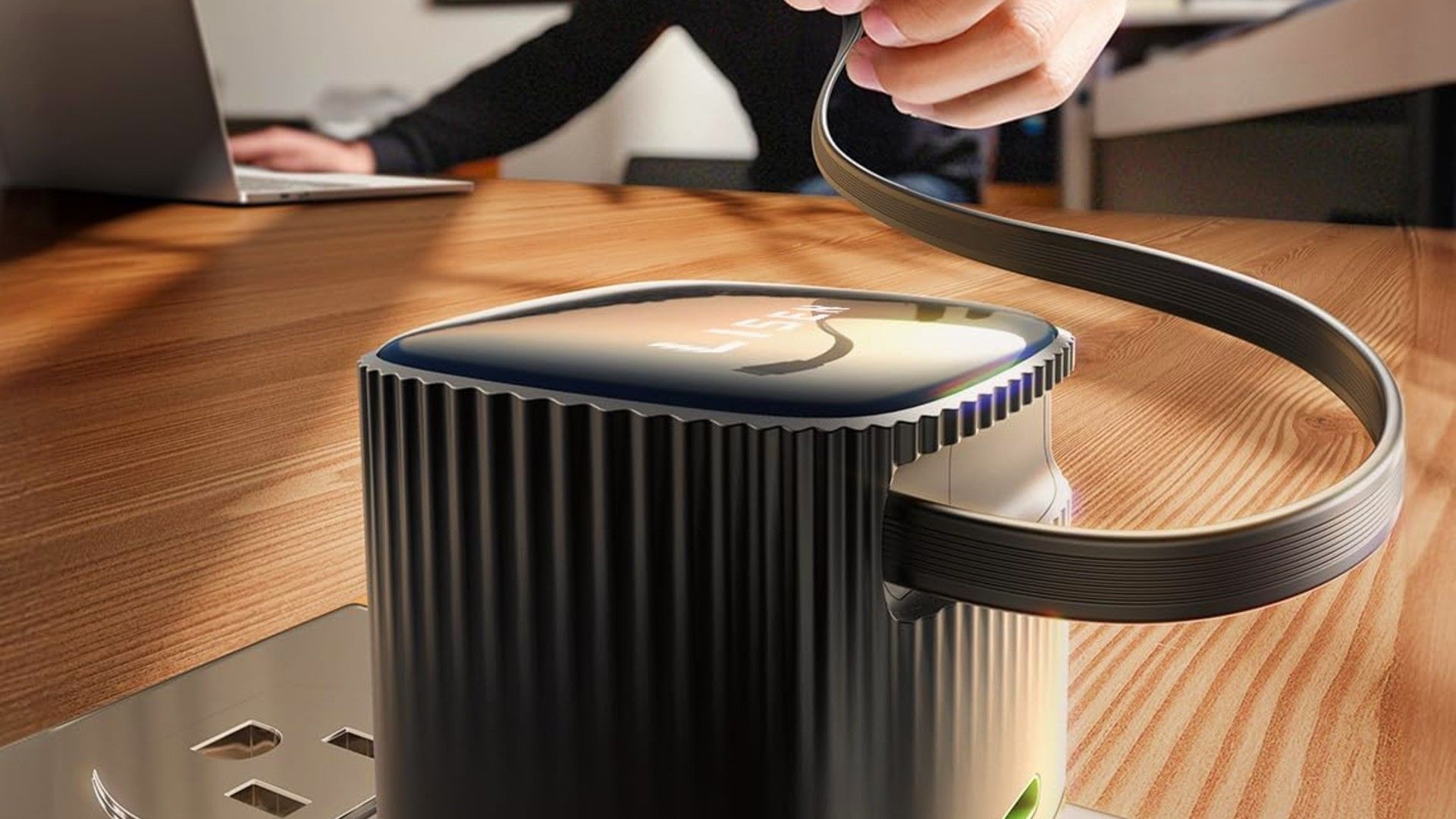 The Lisen Retractable USB-C charger with its cord being pulled out for a user