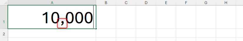 The number 10,000 typed into cell A1 in an Excel worksheet, with a comma as a thousands separator typed manually.