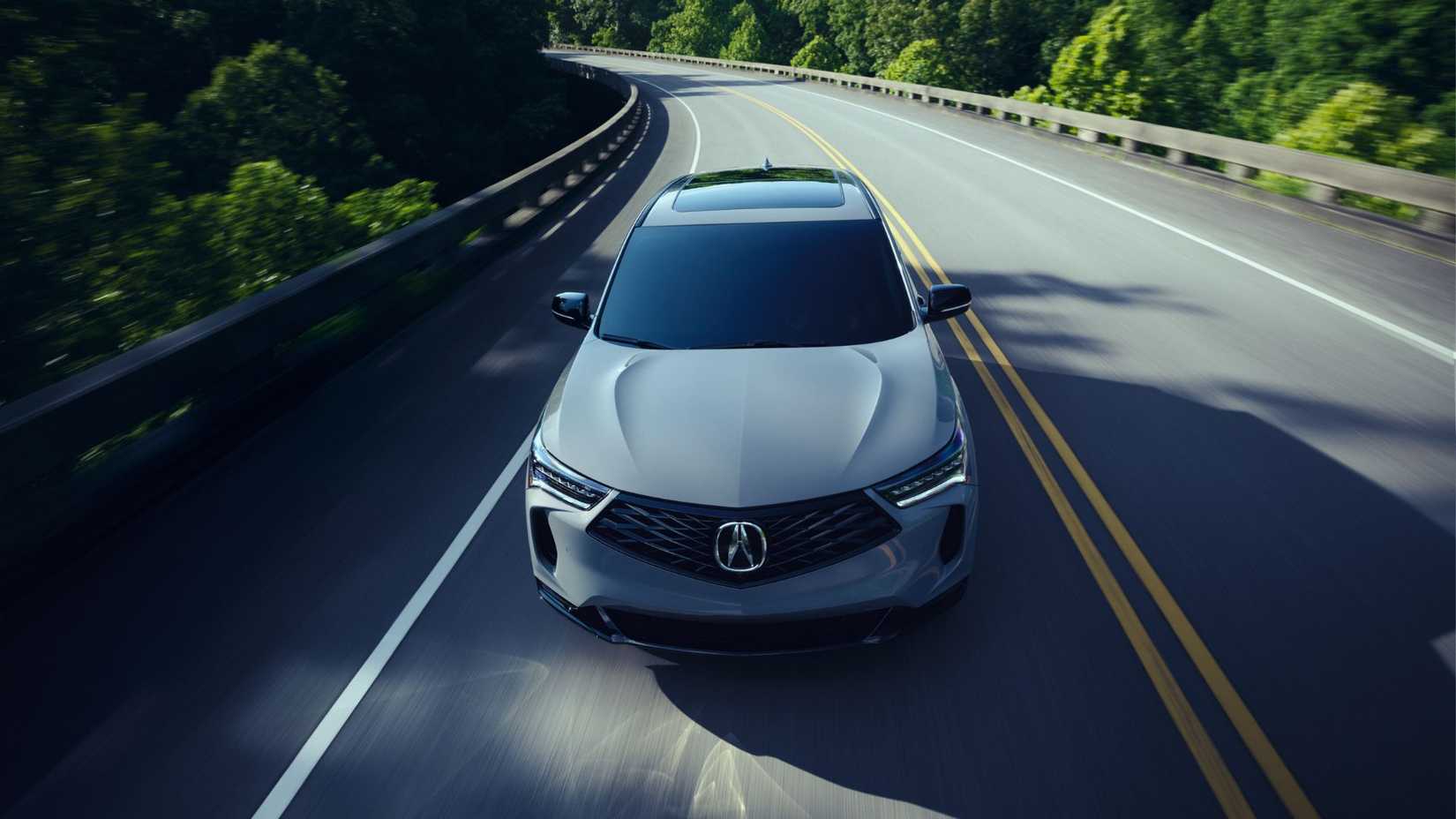 Dynamic front-end shot of a gray 2025 Acura RDX A-Spec.