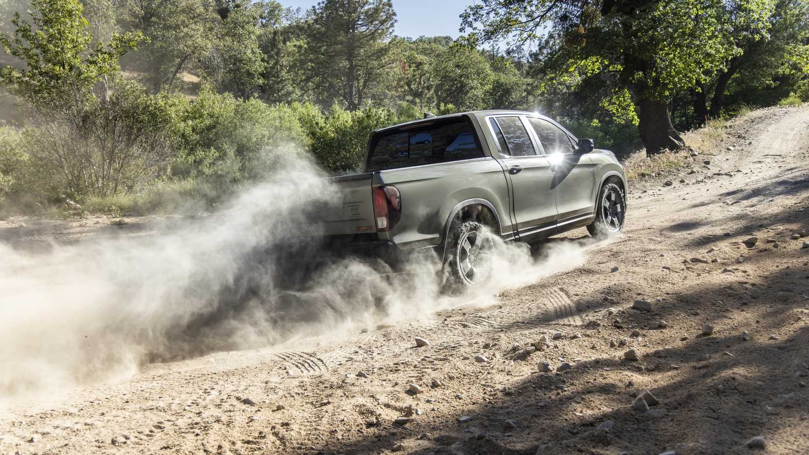 Rear 3/4 action shot of a 2026 Honda Ridgeline TrailSport