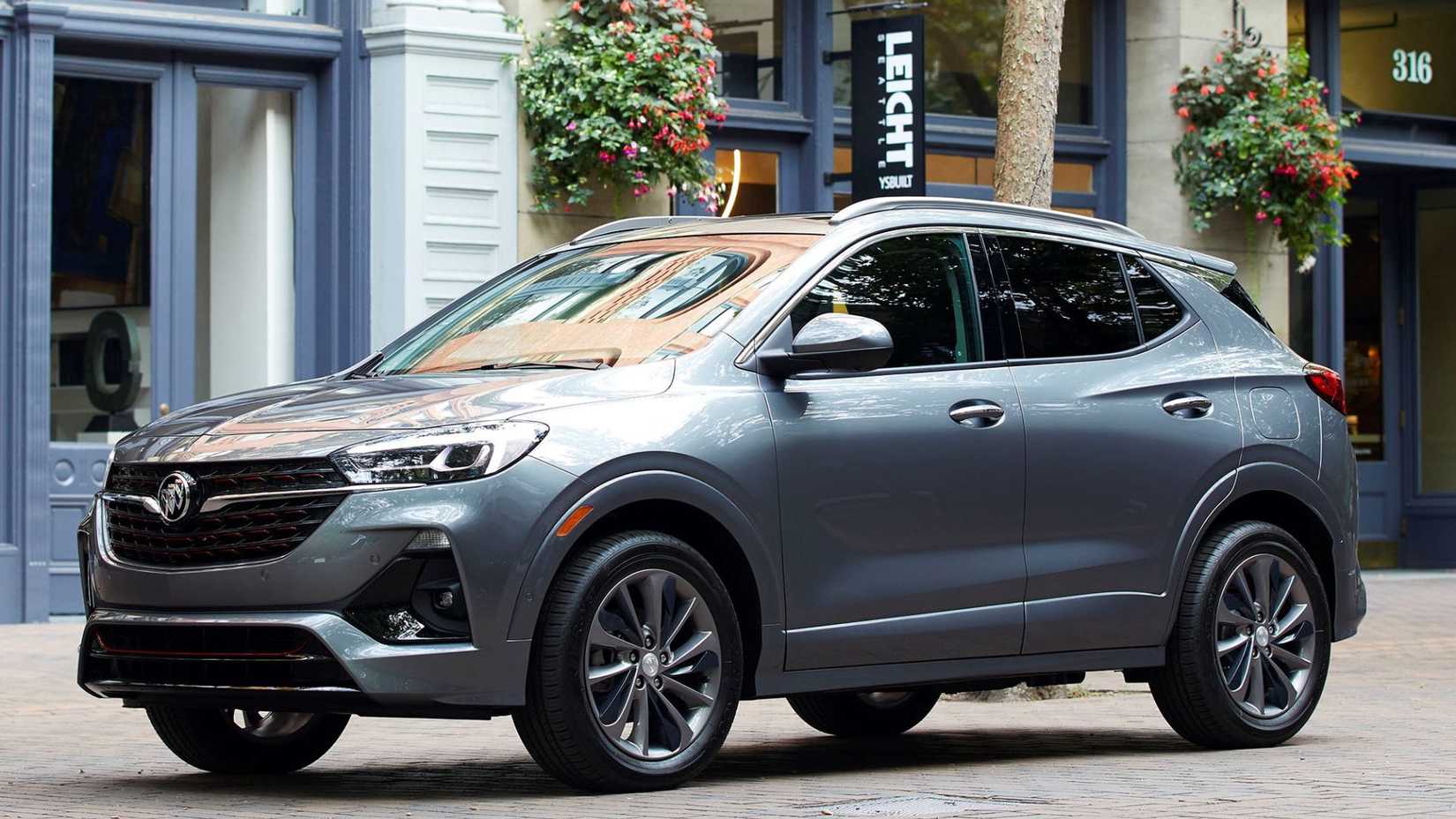 Static front 3/4 shot of a gray 2020 Buick Encore GX ST parked in a city.