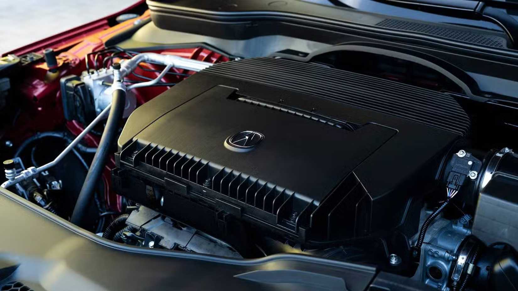 Close-up shot of the 3/5-liter V-6 engine under the hood of a 2023 Acura MDX.