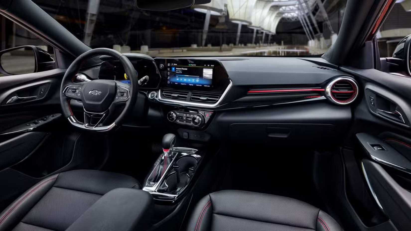 Shot of the front cabin of a Chevrolet Trax RS with the jet black and red accents interior.