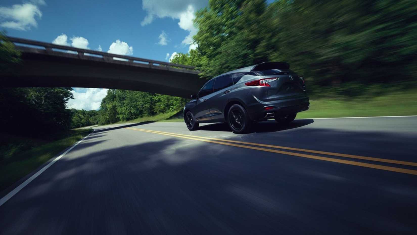 Dynamic rear 3/4 shot of a gray 2026 Acura RDX.