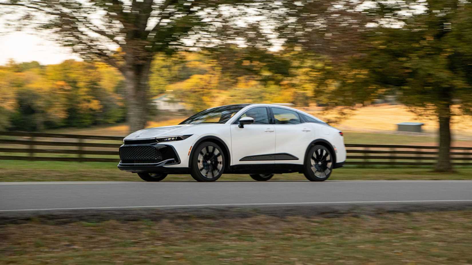 Dynamic front 3/4 shot of a white 2026 Toyota Crown Platinum.