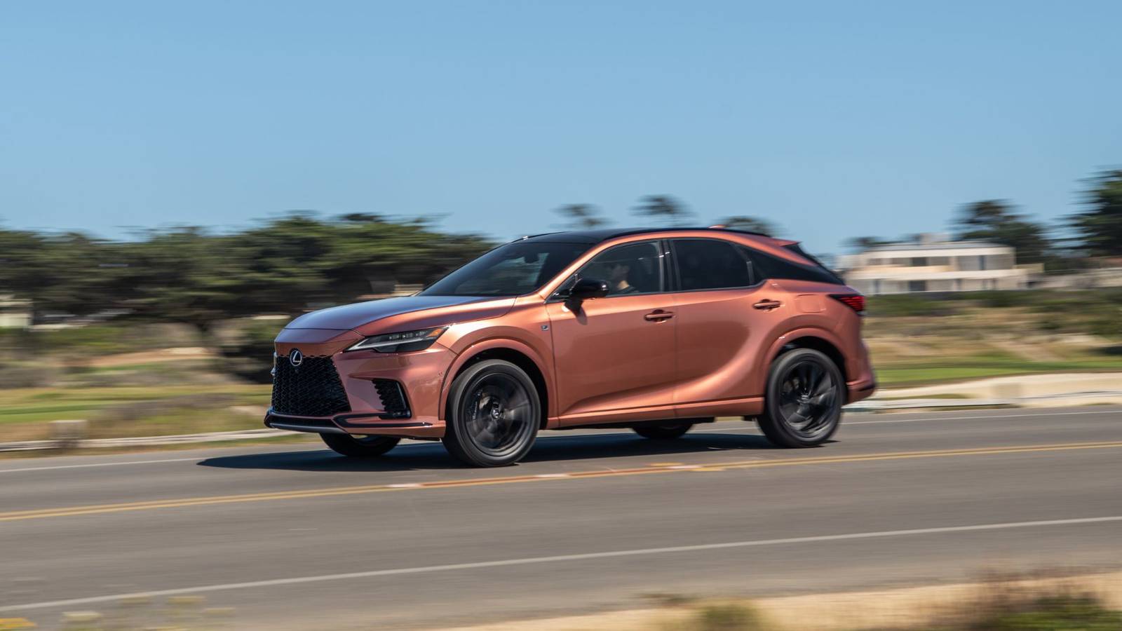 Dynamic front 3/4 shot of a copper 2026 Lexus RX 500h F SPORT.