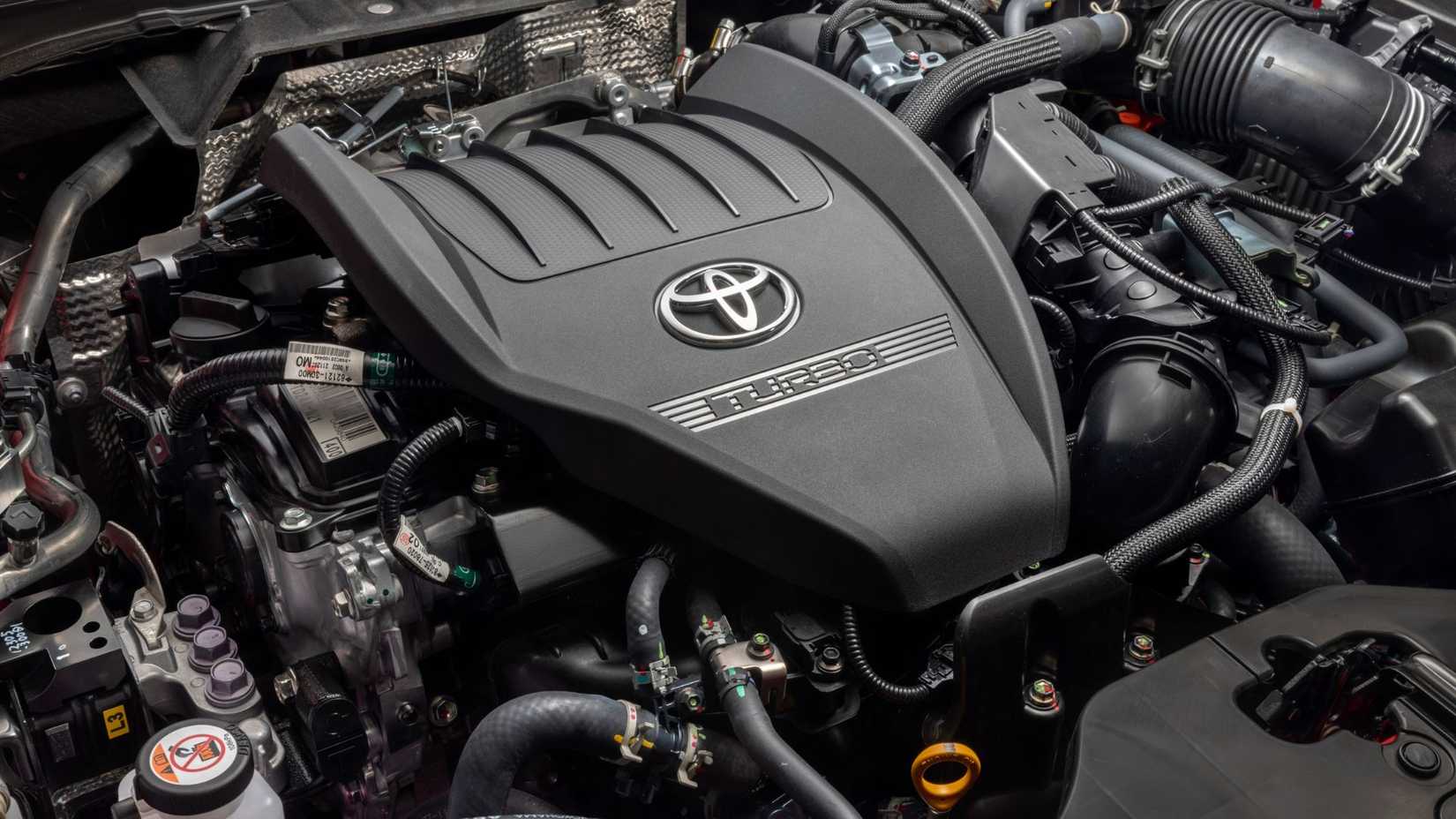 Close-up shot of the 2.4-liter engine under the hood of a 2026 Toyota Crown Platinum.