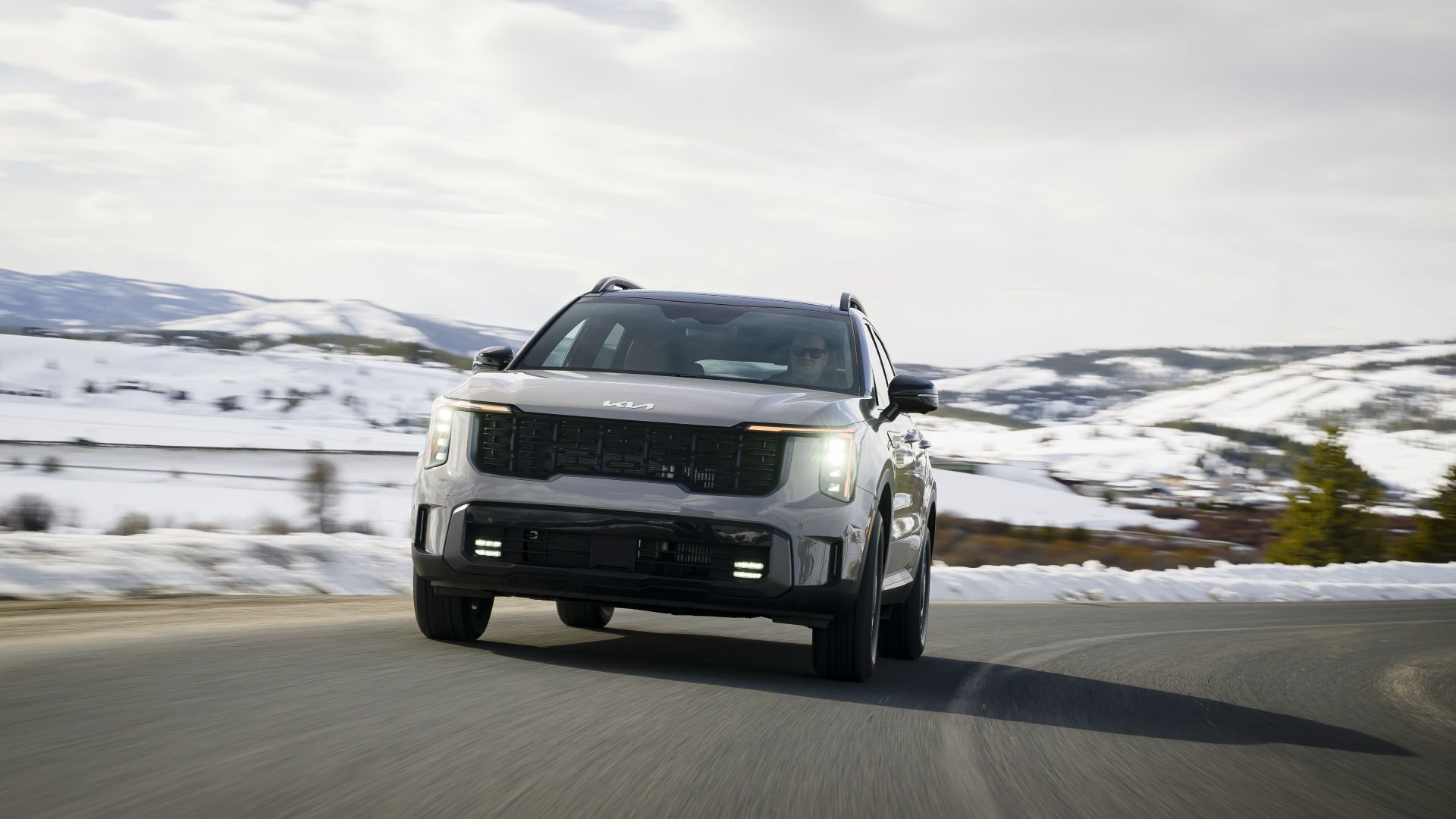 Front 3/4 action shot of a 2024 Kia Sorento