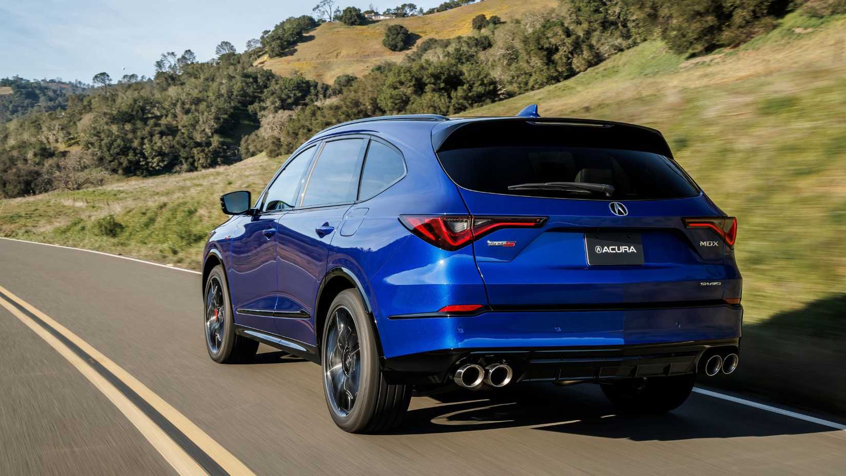 Dynamic rear 3/4 shot of a blue 2022 Acura MDX Type S.