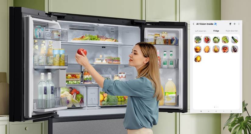 A woman going into a Samsung fridge and getting apples