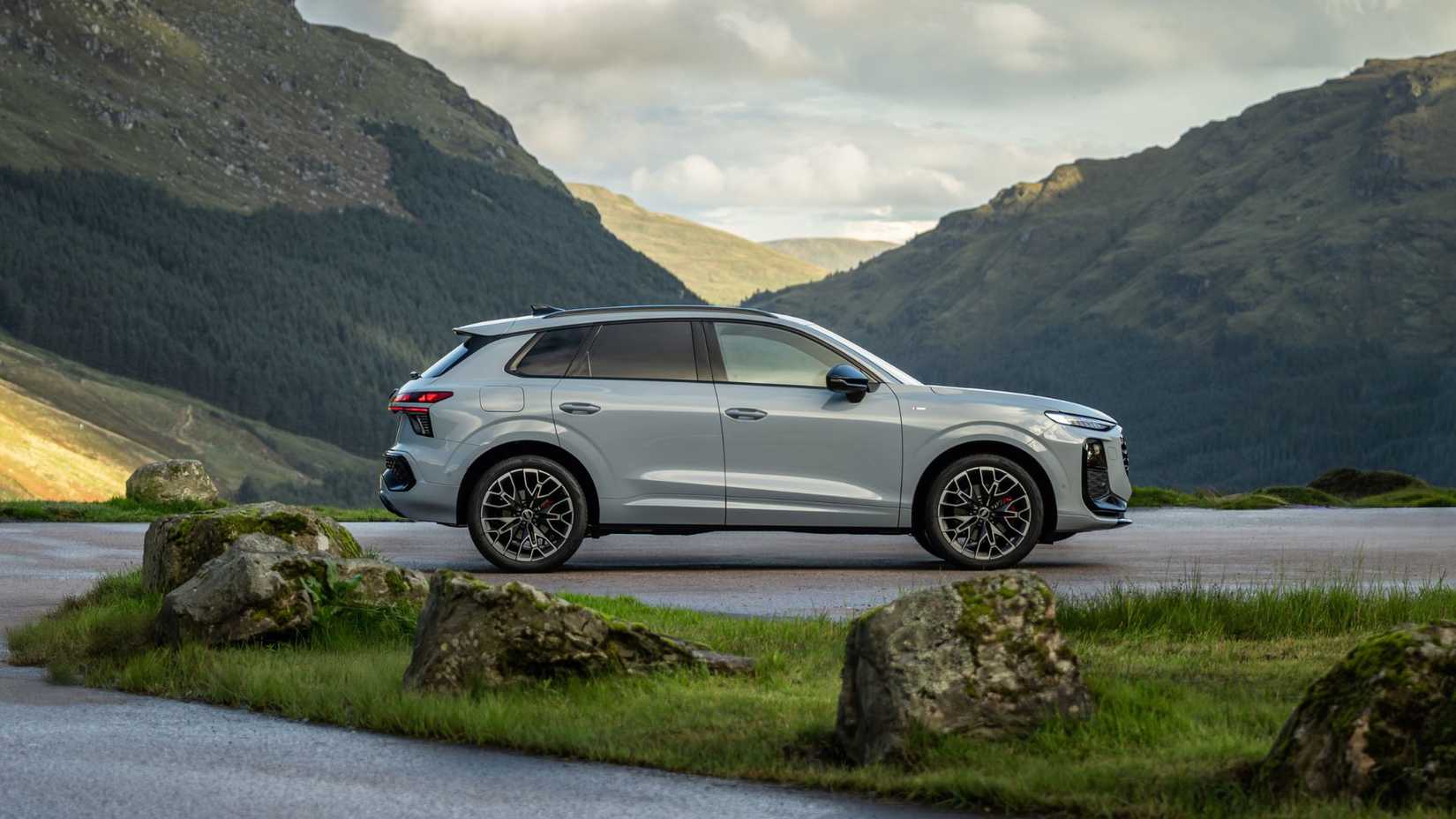 Static side profile shot of a gray 2026 Audi Q3.