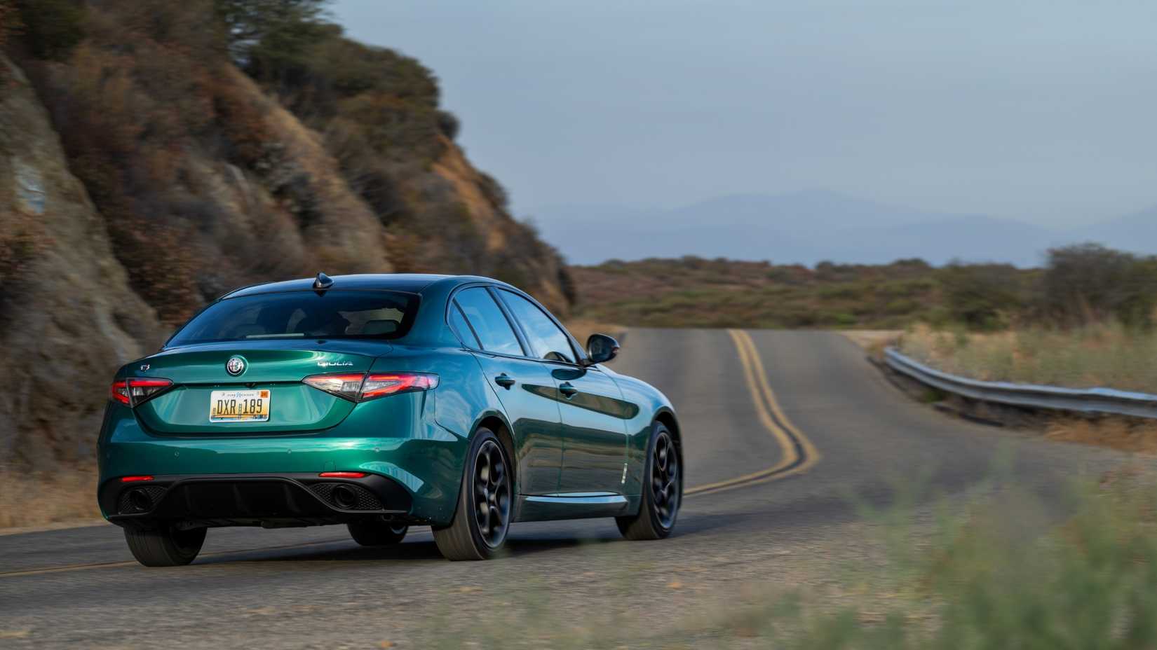 Rear 3/4 action shot of a 2025 Alfa Romeo Giluila Intensa 