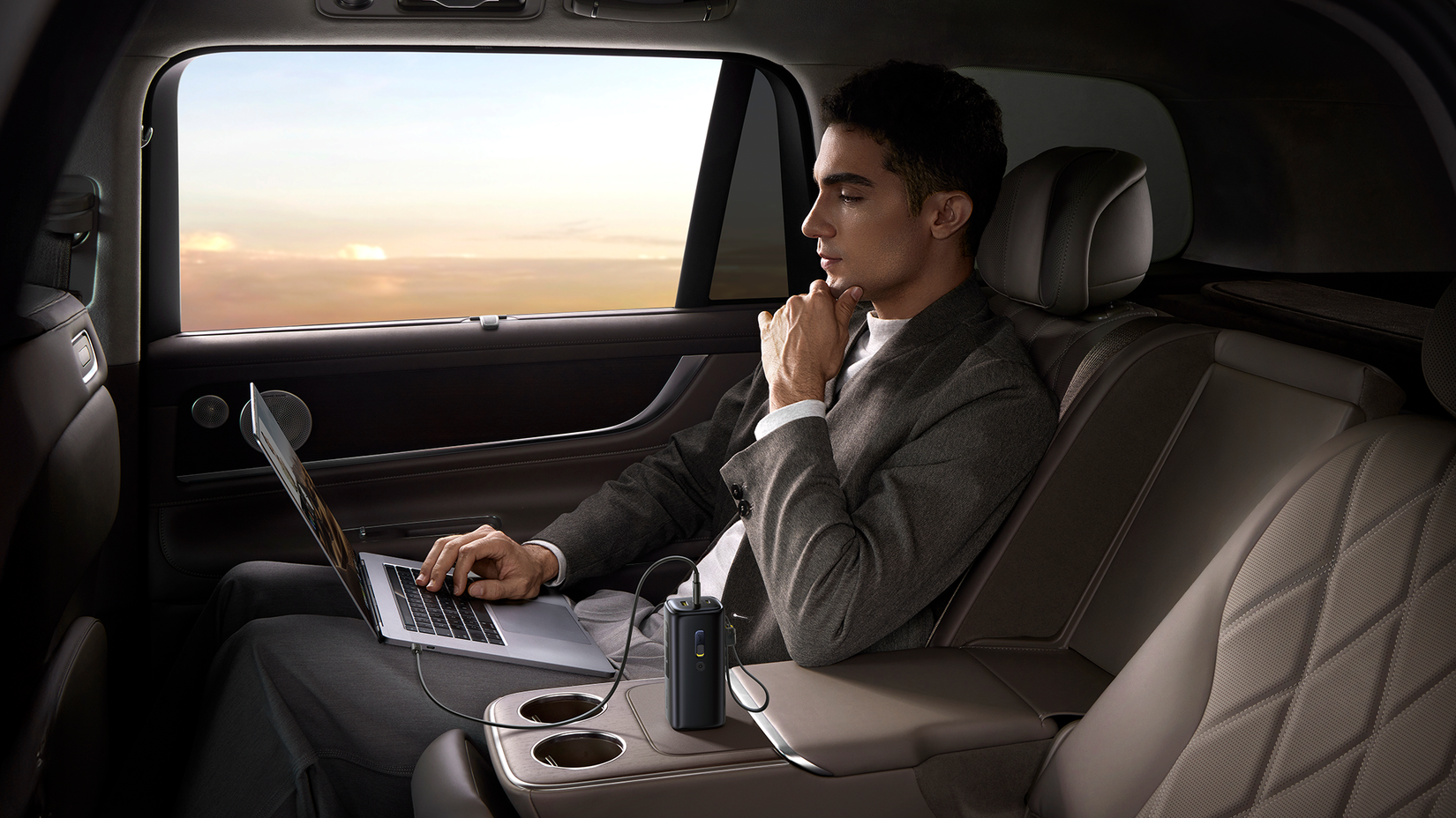 baseus energeek gx11 4G mifi power bank powering a laptop in a car