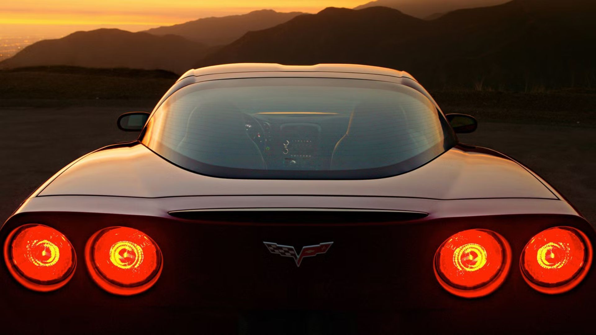 Rear-end shot of a C6 Chevrolet Corvette at dusk.