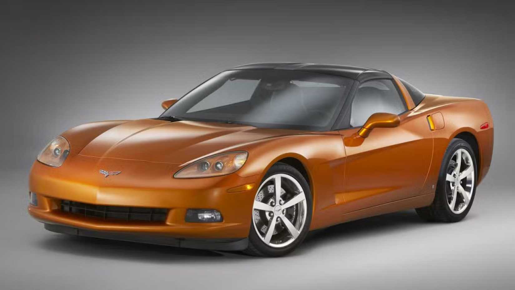 Still 3/4 front shot of an orange Chevrolet Corvette C6.