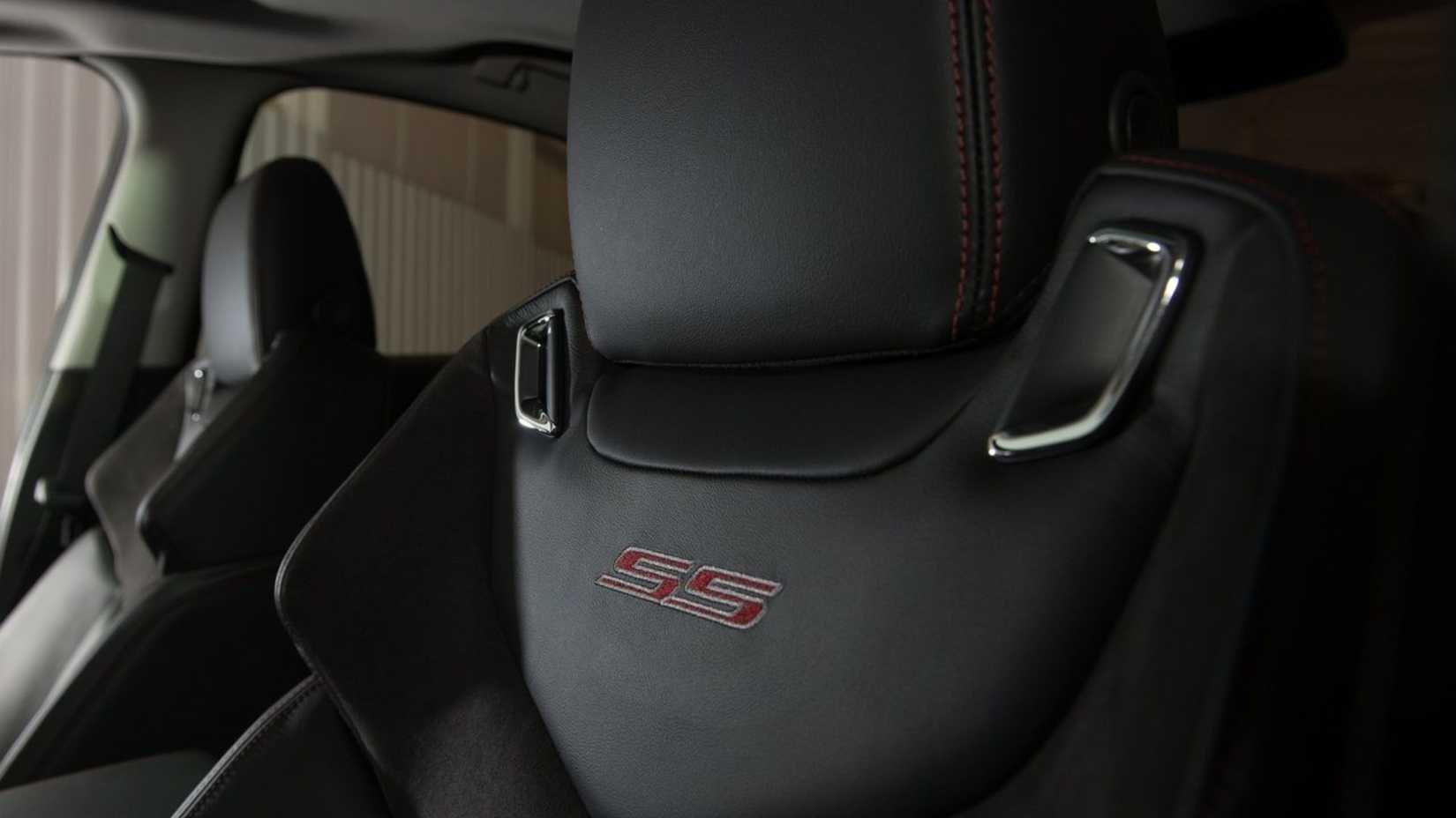 Close-up shot of the 'SS' logo on the seat of a 2014 Chevrolet SS.