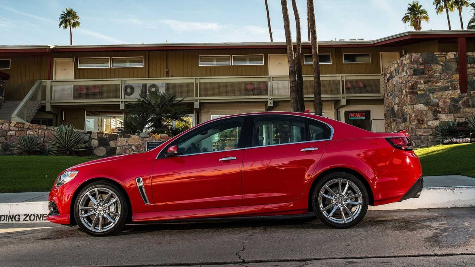 Static side profile shot of a red 2014 Chevrolet SS.