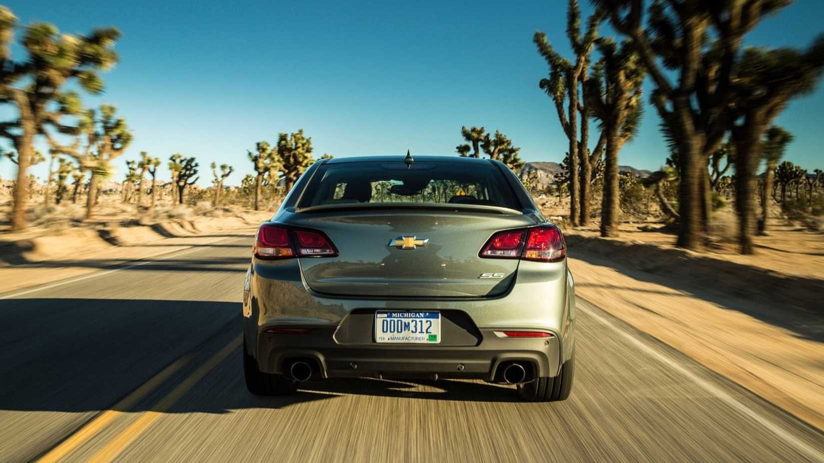 Dynamic rear-end shot of a green 2014 Chevrolet SS.