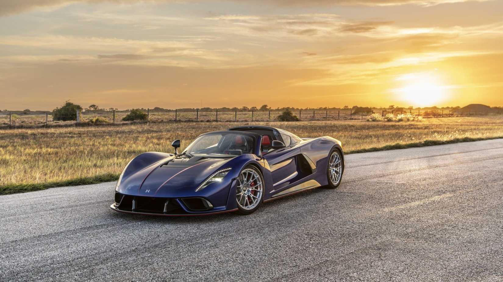 Static front 3/4 shot of a blue Hennessey Venom F5 Roadster.