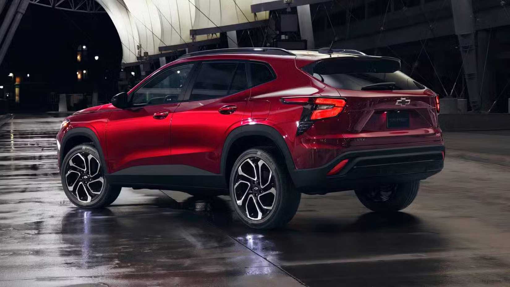 Static rear low-angle shot of 2024 Chevrolet Trax 2RS in red parked on a city street.