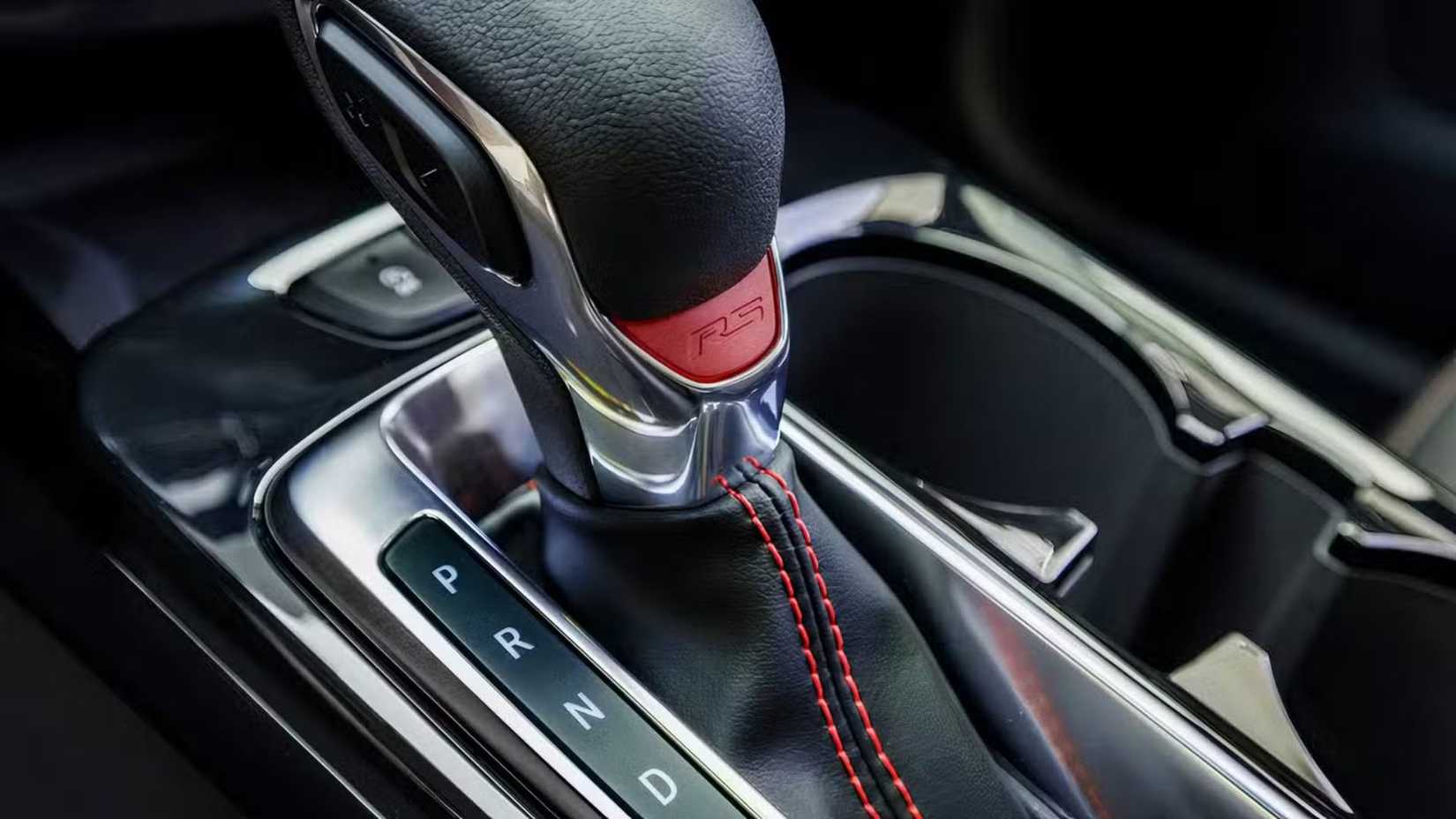 Close-up shot of 2024 Chevrolet Trax 2RS gear shifter with 2RS detailing.