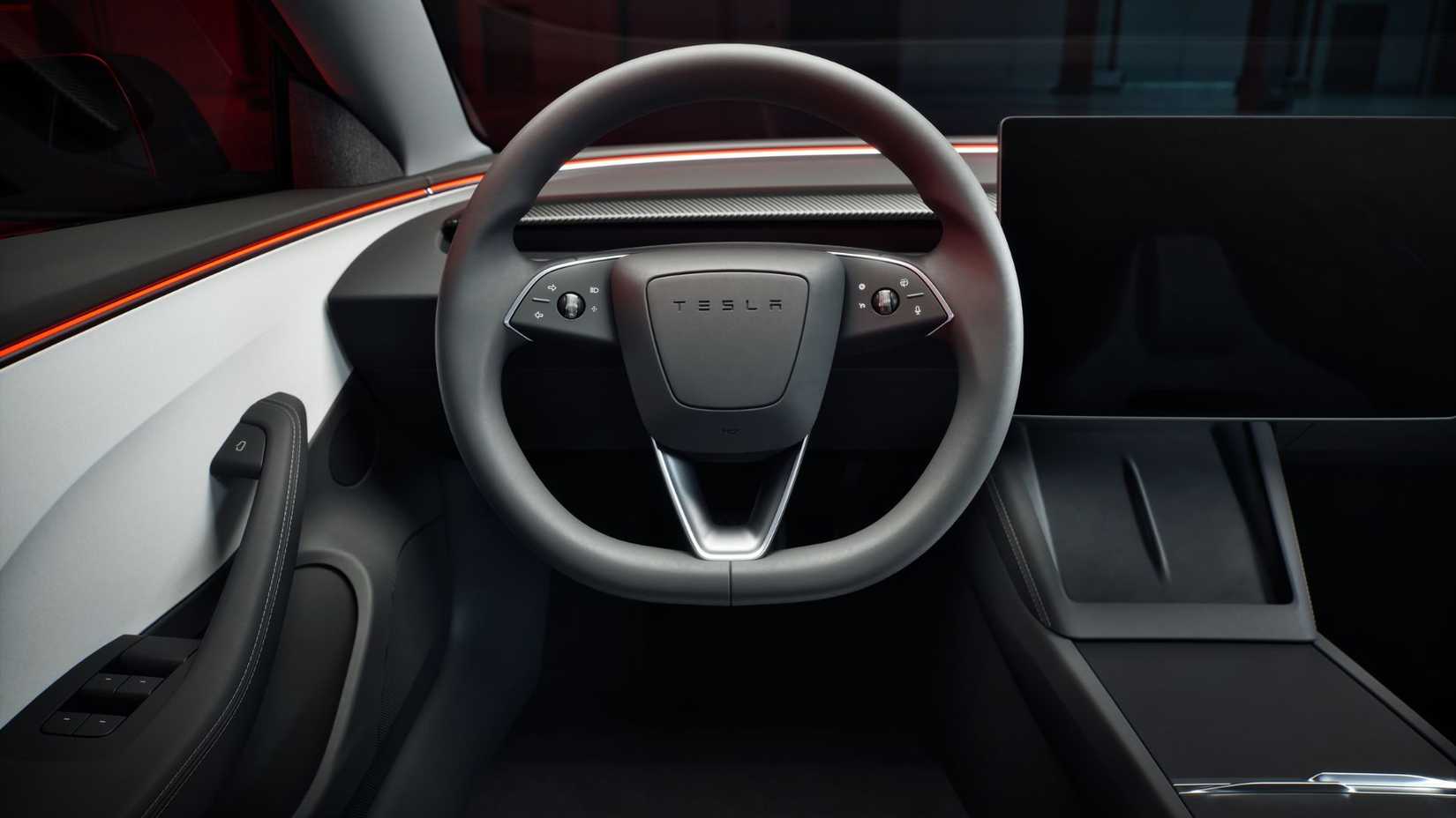 Close-up shot of the steering wheel in a Tesla Model 3 Performance.