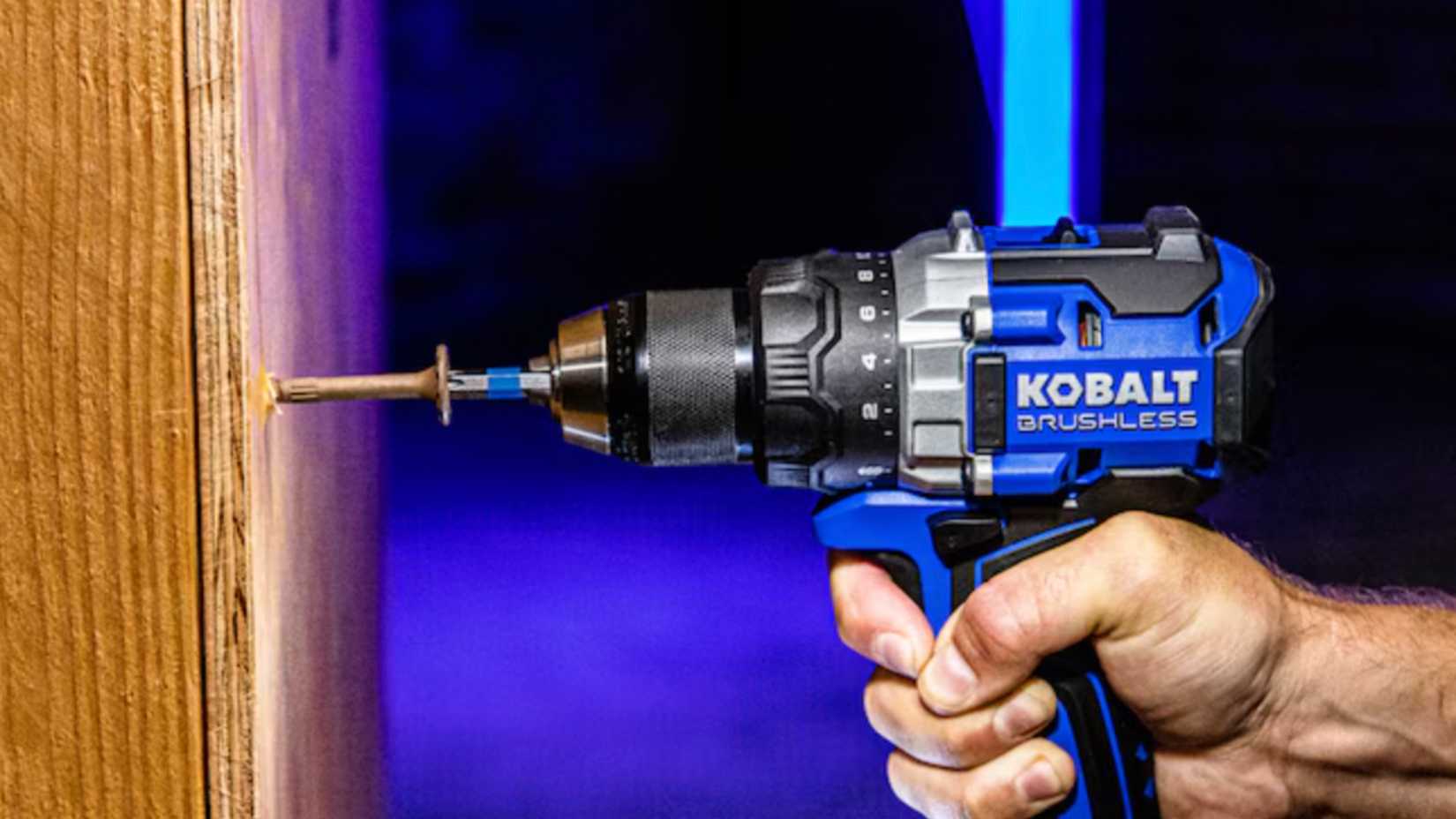 Kobalt power tool drilling into wood.