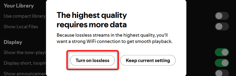 Spotify's desktop app showing notification that lossless streaming requires more data. 