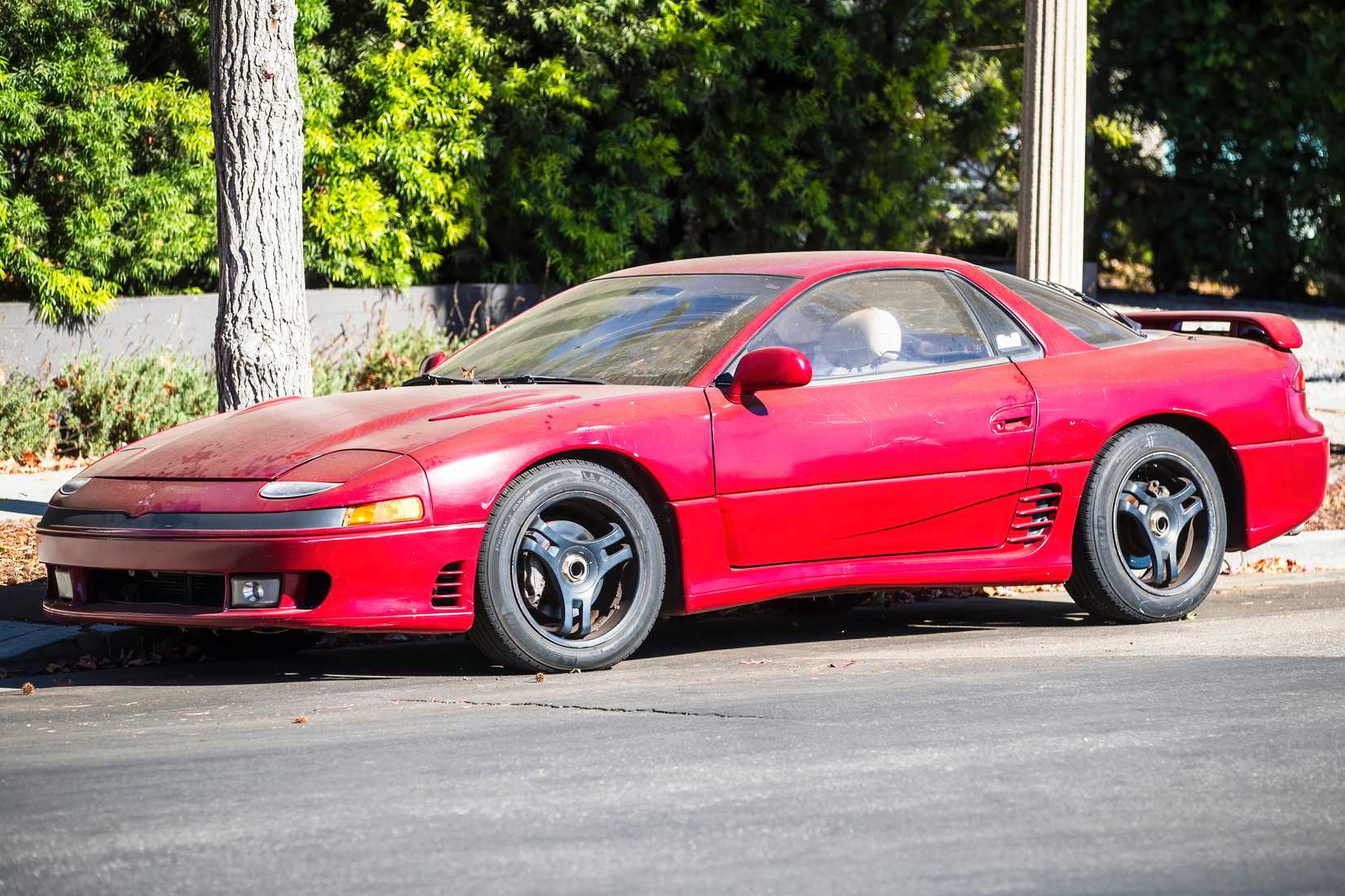 November 15, 2024, Los Angeles, USA A red Mitsubishi 3000GT is parked on the street.