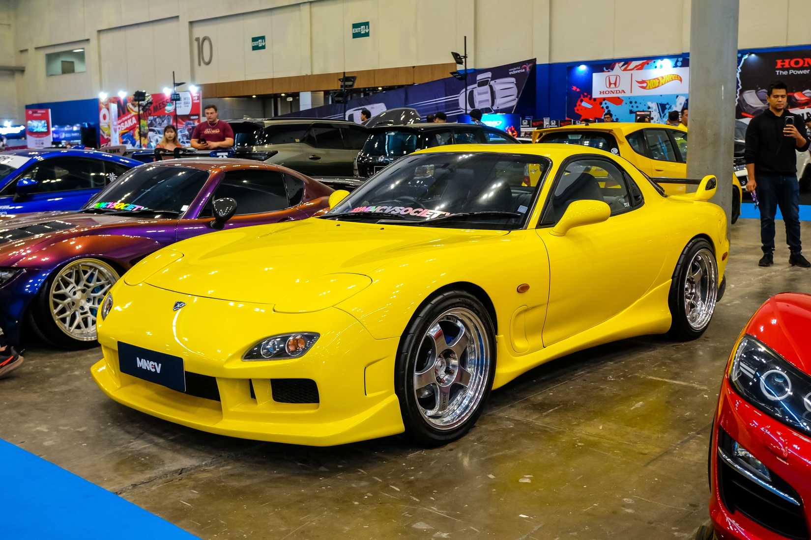 South Tangerang, Indonesia, October 4, 2024. A yellow Mazda RX-7 FD3S coupe with a rotary engine at the Modification Expo 2024 in Indonesia.