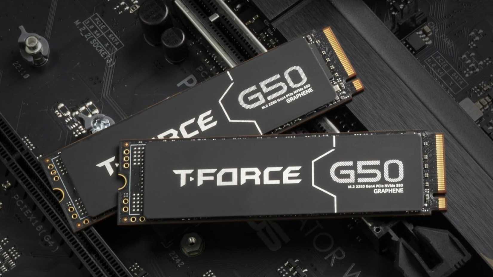 Two TEAMGROUP T-Force G50 NVMe SSDs placed on top of a motherboard. 