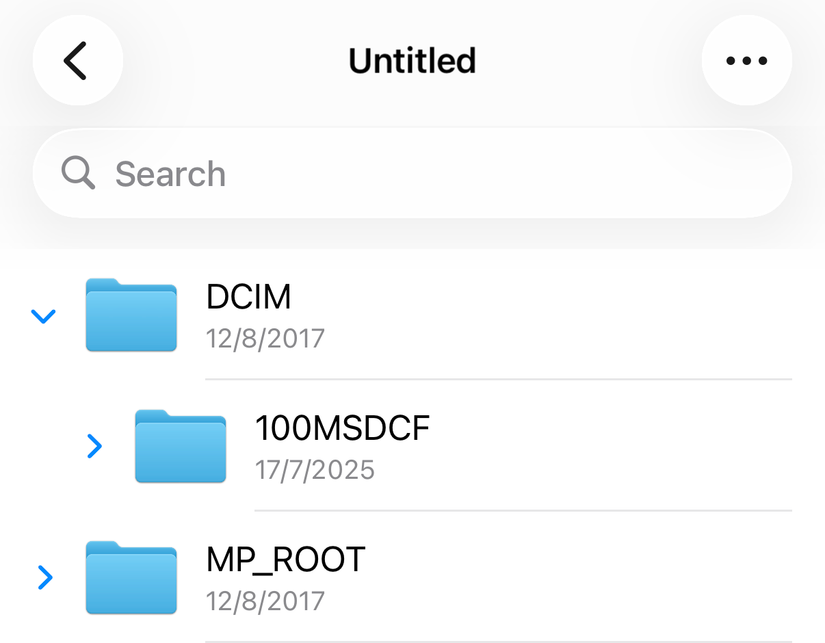 The contents of a digital camera's memory card in the iOS 26 Files app.