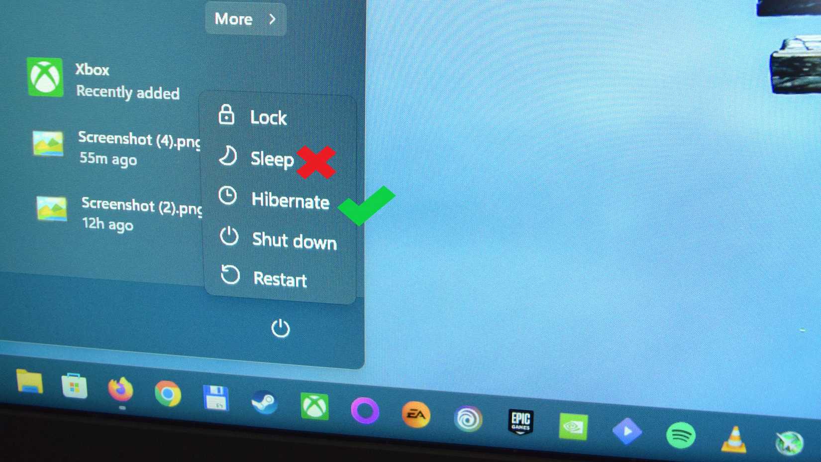 Windows 11 power menu with a red X next to the Sleep button and a green checkmark next to the Hibernate button. 